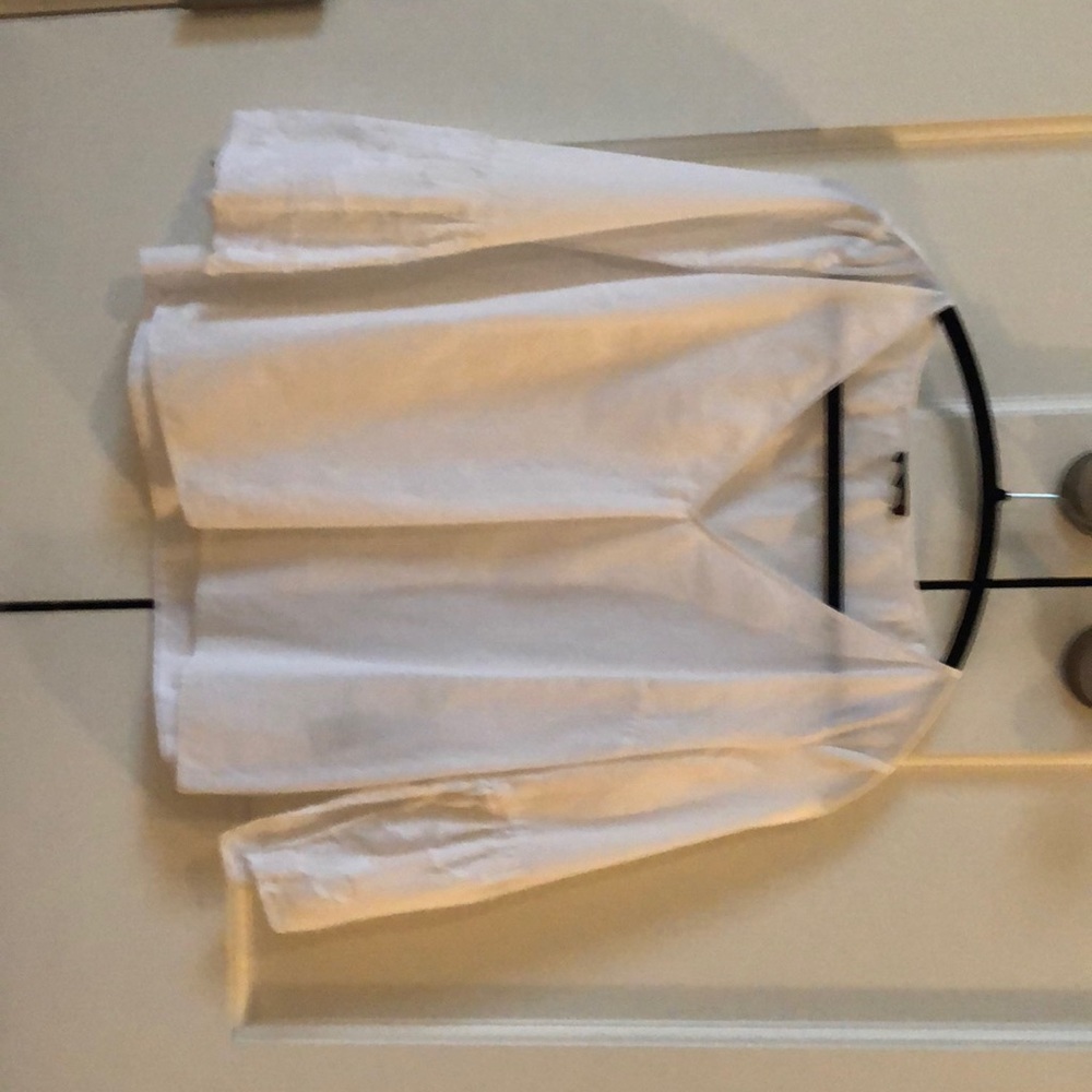 White shirt with sheer detail on sleeve